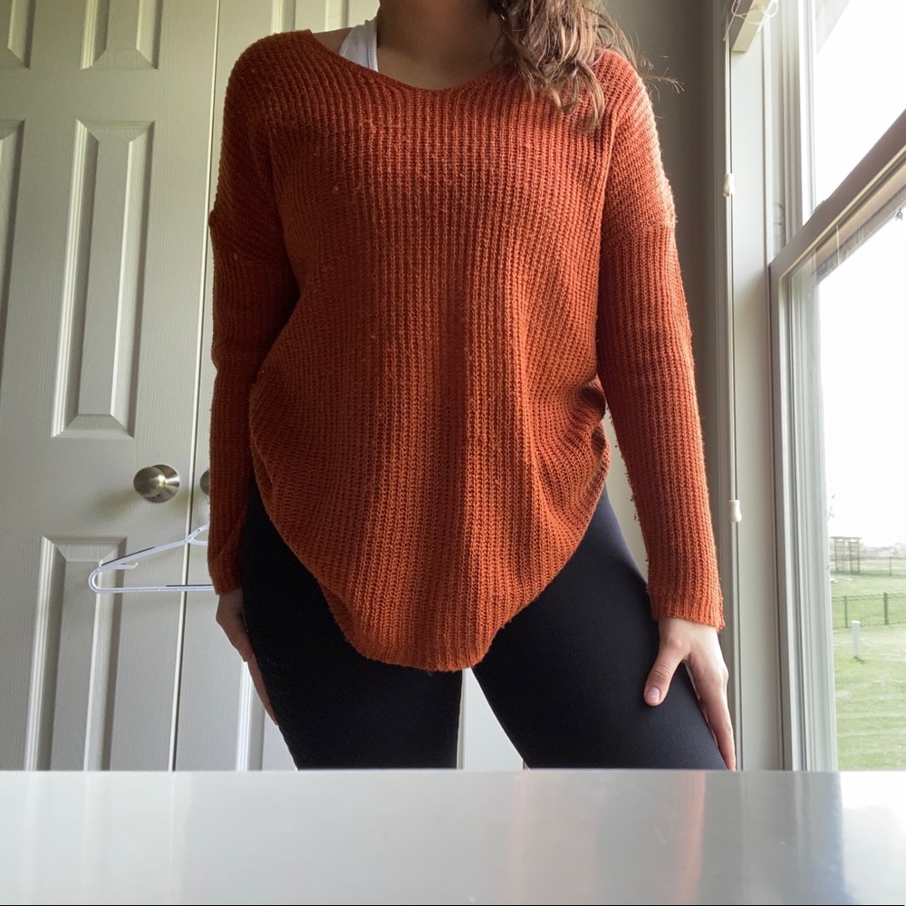 A pull over type of sweater.  Rust color.